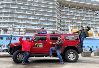 Photo of guests on red hummer